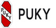 Zu sehen ist das Logo der Marke Puky mit schwarzem Schriftzug in klaren, fetten Großbuchstaben, platziert in einem roten, senkrecht stehenden Sechseck mit schwarzer Umrandung.